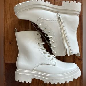 A New Day white boots.